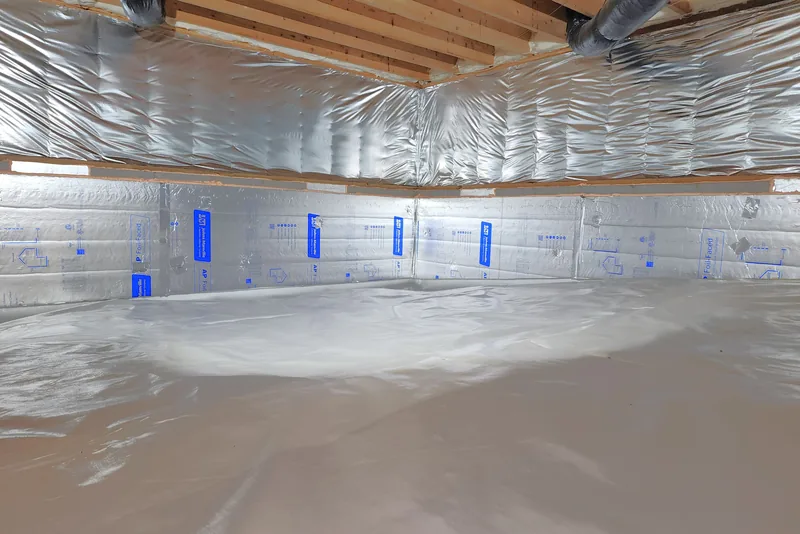 Encapsulated Wake County NC crawl space with foil-faced wall insulation and a sealed vapor barrier floor