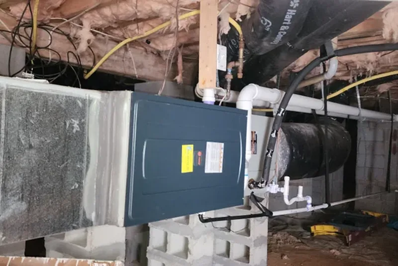 HVAC air handler and ductwork in crawl space during home energy audit in NC