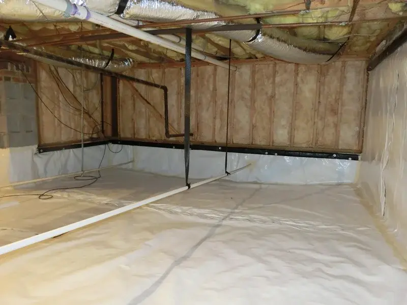 Crawl space with new vapor barrier and insulation — Holly Springs NC