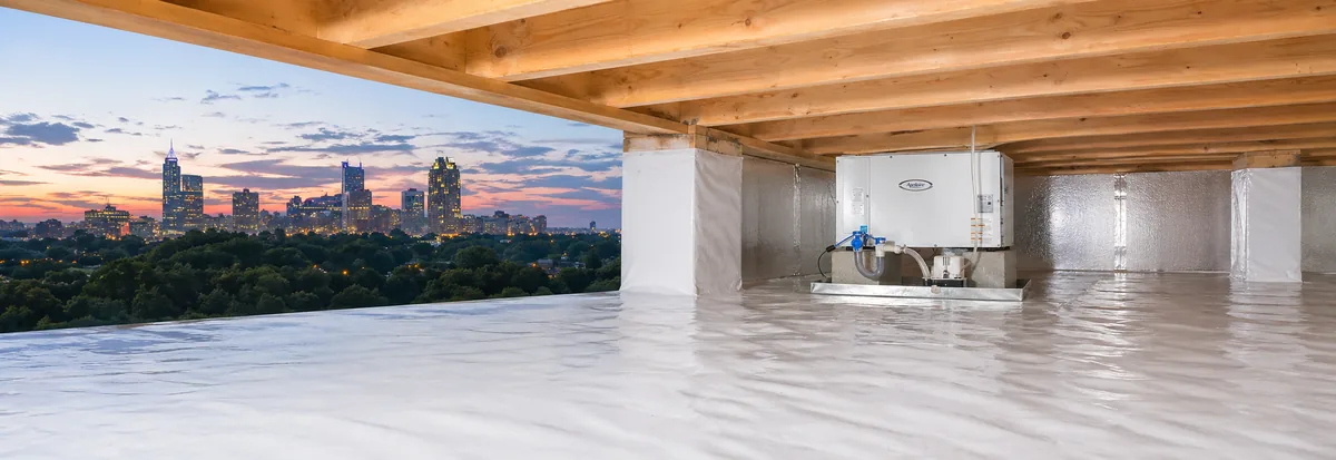 Composite of the Raleigh NC skyline at sunset and an encapsulated crawl space with a dehumidifier installed by Peak Energy